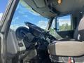 Interior view of a 2014 International 7400 truck cabin showing the steering wheel dashboard and driver's seat