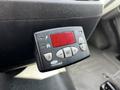 A digital control panel for a 2015 Ford Transit with buttons for adjusting settings and a red display showing the temperature or status