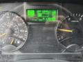 Dashboard display of a 2012 Mitsubishi Fuso FE showing speedometer, odometer at 129352 miles, and warning indicators including DPF level and gear selection