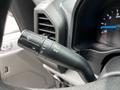A control lever from the steering column of a 2017 Ford F-250 used for operating turn signals and windshield wipers