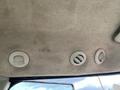 Ceiling interior of a 2014 John Deere 1585 Terrain Cut featuring three air vents in circular housings