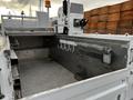 A 2016 Ford F-550 truck bed with metal surfaces and hooks for tools or equipment visible inside the cargo area