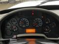 Dashboard of a 2011 International DuraStar 4300 showing various gauges for RPM speed fuel and temperature