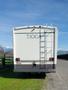 A 1998 Fleetwood Tioga Bunkbed with a white exterior and a ladder on the back