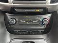 Dashboard controls of a 2019 Ford Transit Connect featuring climate control knobs and buttons for air conditioning and other settings