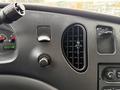 Dashboard of a 2008 Ford Econoline featuring speedometer fuel gauge air vent and control switches