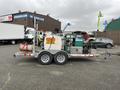 2011 Hightliner Aquacide Hot Water Weed Control Dual Flat Deck Trailer with various equipment including hoses and tanks