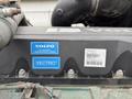 Close-up of a 2012 Volvo VNL engine label showing the Volvo logo and the Vectro branding along with serial and chassis identification numbers