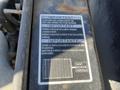 A close-up of an important safety label on a Kubota F3990 highlighting ventilation warnings and usage instructions in English and Spanish