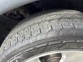 Close-up of a tire from a 2015 Dodge Durango showing tread patterns and brand lettering on the sidewall