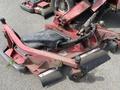 A red Toro Groundsmaster 5910 mower deck with dual blades attached to a compact chassis showing signs of wear and dirt