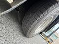 A close-up view of a tire from a 2017 Chevrolet Express showing the tread pattern and sidewall detail