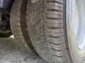 Tires of a 2017 Chevrolet Express showing tread patterns with some wear and dirt on the surface