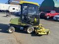 A 2010 Kubota F3680 compact tractor equipped with a glass cabin and front-mounted mower deck in a parking lot