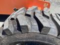 Close-up of a large tire from a 2008 JLG Boom Lift showing deep treads and rugged texture designed for stability on various surfaces