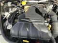 Close-up of a Chrysler PT Cruiser engine featuring a 2.4L TURBO intake manifold with labels and various connected components