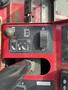 Control panel of a 2012 Toro Groundsmaster 5910 featuring levers and indicator symbols for operation and adjustments