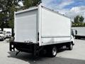 A white 2018 Hino 195 box truck with a large cargo area and a flat rear panel visible from the back