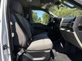 Interior view of a 2020 Ford F-350 SD featuring gray cloth seats and a black dashboard with controls visible