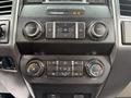 Dashboard controls of a 2019 Ford F-350 SD featuring audio and climate control buttons with various dials and buttons for adjusting settings