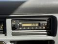 Dashboard of a 2007 GMC W5500 18 Foot Cube Van featuring a CD player and digital clock display showing 1238