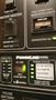 Control panel of a 2007 Winnebago Adventure featuring various switches and status indicators for water heater battery and power system