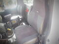 The interior of a 2016 International WorkStar 7500 showing a driver's seat and dashboard controls