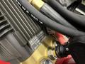 Close-up of the engine components and hoses of a 2024 Magnum 4000 Hot Water Pressure Washer featuring the EASY KLEEN label and specifications