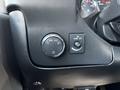 Close-up of the control panel in a 2017 Chevrolet Express showing light settings and a button labeled dome off