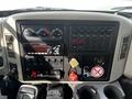 Dashboard of a 2008 International 7500 featuring various gauges switches and a stereo system