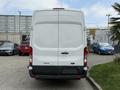 A white 2017 Ford Transit van viewed from the rear with no visible markings or cargo attached