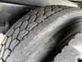 A close-up of the tread of a 2017 Hino 338 tire showing its worn pattern and texture