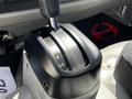 Close-up of the gear shift lever of a 2020 Hino 155 showing positions P R N D 4 L 3