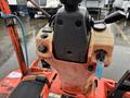 Close-up of the control panel on a 2012 Kubota F3680 featuring various buttons a throttle lever and an ignition key without any visible branding or logos