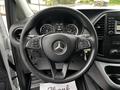 The steering wheel of a 2020 Mercedes-Benz Metris featuring controls for various functions and the iconic Mercedes-Benz logo in the center