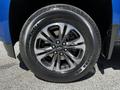 A close-up of a 2021 Chevrolet Colorado wheel featuring a five-spoke alloy rim and a black tire with white lettering
