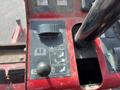 Control panel of a 2014 Toro Groundmaster 5910 featuring various buttons and gauges for operation and adjustment