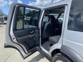A 2006 Land Rover LR3 with an open rear door revealing the interior seating and dashboard