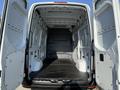 Interior view of a 2020 Mercedes-Benz Sprinter van showcasing an empty cargo space with high ceilings and side walls designed for storage