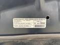 2013 Dodge Journey with a visible vehicle emission control information label attached to the engine compartment