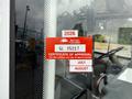A red certification sticker on a vehicle's window indicating British Columbia approval with the year 2026 and various text elements