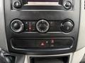 The image shows the control panel of a 2016 Mercedes-Benz Sprinter featuring climate controls and settings for the radio and sound system