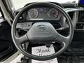 Interior view of a 2020 Hino 338 truck featuring a steering wheel and instrument panel with gauges