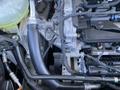 Close-up view of the engine components of a 2023 Ford Bronco Sport including hoses and metal parts