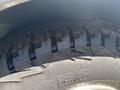 Close-up of a tire from a 2017 Chevrolet Express showing deep tread patterns designed for traction and durability