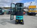 A 2024 AGT Industrial QH13R Mini Excavator with a glass cabin and tracks positioned in a parking area with other vehicles in the background