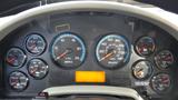 Dashboard of a 2015 International WorkStar 7600 Dump Truck displaying various gauges for speed water temperature fuel and more