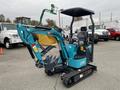 2024 AGT Mini Excavator in turquoise with tracks and a bucket attachment visible in the foreground