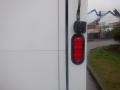 A red rear light attached to the side of a 2019 Isuzu NQR truck
