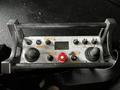 A control panel with various buttons and joysticks labeled for operations on a Spartan Gladiator vehicle